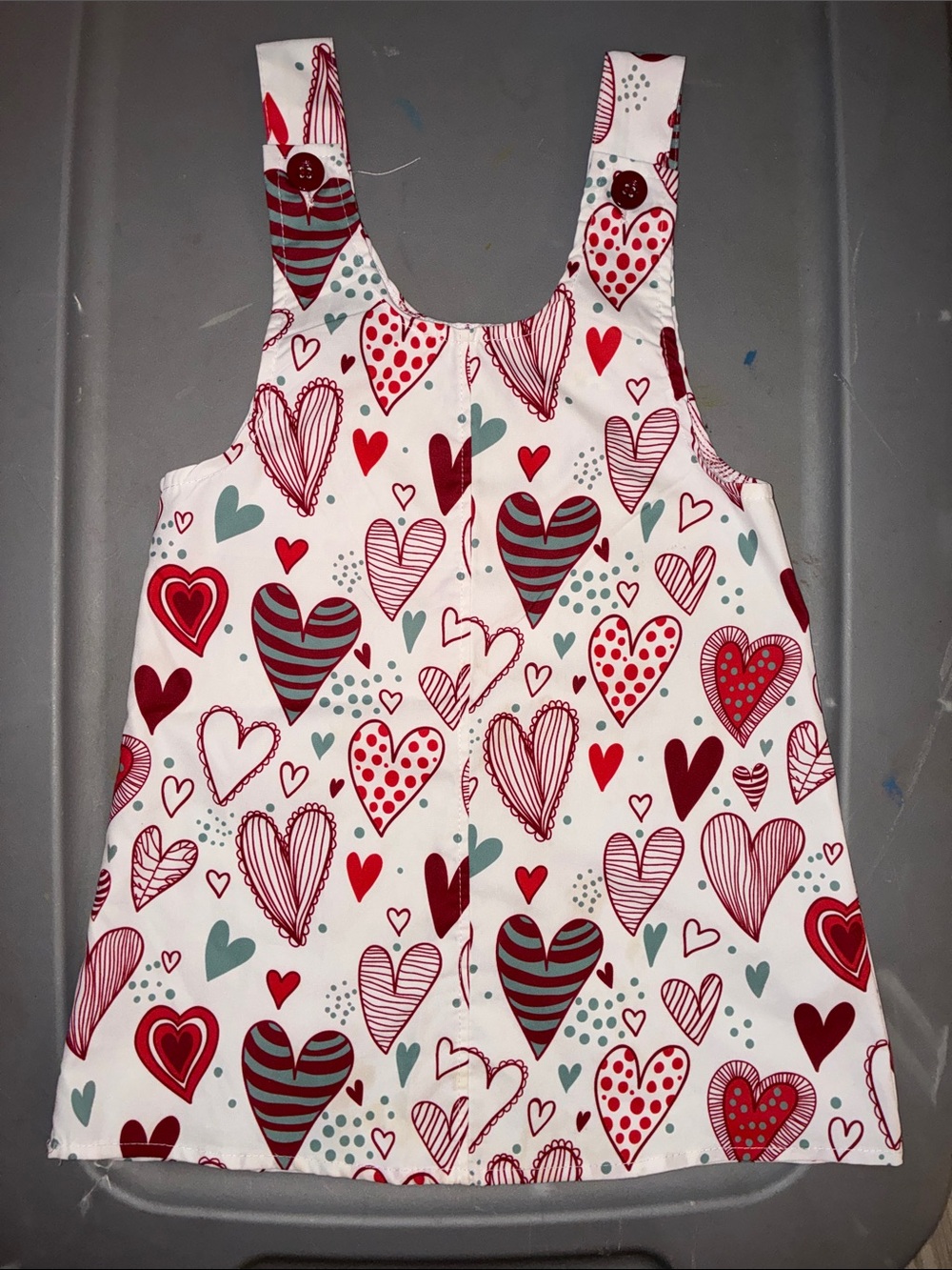 8️⃣ Girls White Heart-Print Pinafore Dress - Playful Red & Teal Hearts
